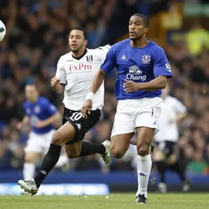 Intense Rivalry: Dembele vs. Distin - Everton vs. Fulham's Premier League Showdown at Goodison Park (19 March 2011) Intense Rivalry: Dembele vs. Distin - Everton vs. Fulham's Premier League Showdown at Goodison Park (19 March 2011)