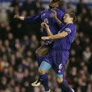 Intense Rivalry: Distin vs Jagielka's Battle for the Ball - Everton vs Stoke City, Barclays Premier League (01.01.2011) Intense Rivalry: Distin vs Jagielka's Battle for the Ball - Everton vs Stoke City, Barclays Premier League (01.01.2011)