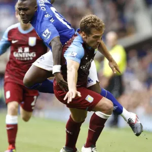 Intense Rivalry: Drenthe vs. Petrov Battle at Goodison Park - Everton vs. Aston Villa, Barclays Premier League (2011)