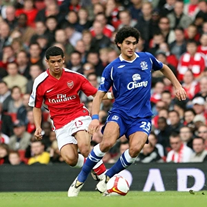 Intense Rivalry: Fellaini vs. Denilson in Arsenal vs. Everton Premier League Clash