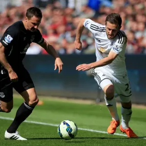 Intense Rivalry: Jagielka vs. Sigurdsson Battle at Swansea City vs. Everton (Barclays Premier League) Intense Rivalry: Jagielka vs. Sigurdsson Battle at Swansea City vs. Everton (Barclays Premier League)