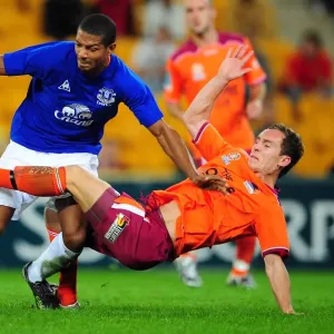 Intense Rivalry: Jermaine Beckford vs Matt Smith Battle for Ball at Suncorp Stadium - Everton vs Brisbane Roar Intense Rivalry: Jermaine Beckford vs Matt Smith Battle for Ball at Suncorp Stadium - Everton vs Brisbane Roar
