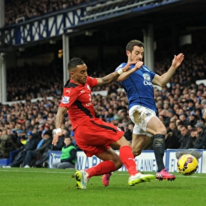 Intense Rivalry: Leighton Baines vs. Danny Simpson - Everton vs. Leicester City, Premier League Battle for the Ball