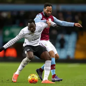 Intense Rivalry: Lukaku vs. Lescott's Battle for Ball Possession - Aston Villa vs. Everton, Premier League Intense Rivalry: Lukaku vs. Lescott's Battle for Ball Possession - Aston Villa vs. Everton, Premier League