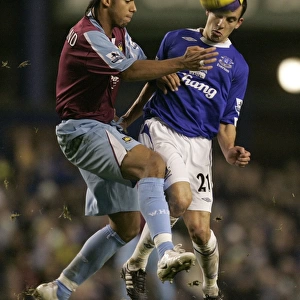 Intense Rivalry: Osman vs. Ferdinand Battle for the Ball - Everton vs. West Ham United