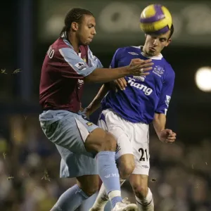 Intense Rivalry: Osman vs. Ferdinand Battle for the Ball - Everton vs. West Ham United Intense Rivalry: Osman vs. Ferdinand Battle for the Ball - Everton vs. West Ham United