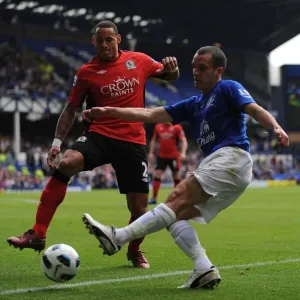 Intense Rivalry: Osman vs. Jones - A Battle for Ball Possession, Everton vs. Blackburn Rovers, Barclays Premier League (16 April 2011, Goodison Park) Intense Rivalry: Osman vs. Jones - A Battle for Ball Possession, Everton vs. Blackburn Rovers, Barclays Premier League (16 April 2011, Goodison Park)