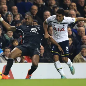 Intense Rivalry: Paulinho vs. Distin - Tottenham Hotspur vs. Everton: A Battle for Supremacy in the Premier League