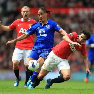 Intense Rivalry: Rafael Da Silva vs. Steven Pienaar - Battle for Ball Possession (Manchester United vs. Everton, Barclays Premier League, Old Trafford, 2012) Intense Rivalry: Rafael Da Silva vs. Steven Pienaar - Battle for Ball Possession (Manchester United vs. Everton, Barclays Premier League, Old Trafford, 2012)