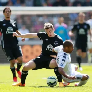 Intense Rivalry: Seamus Coleman vs Wayne Routledge - Swansea City vs Everton, Premier League: A Battle for the Ball Intense Rivalry: Seamus Coleman vs Wayne Routledge - Swansea City vs Everton, Premier League: A Battle for the Ball