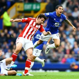 Intense Rivalry: Tim Cahill vs. Marc Wilson - Everton vs. Stoke City's Fierce Battle for Possession Intense Rivalry: Tim Cahill vs. Marc Wilson - Everton vs. Stoke City's Fierce Battle for Possession