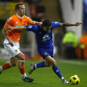Intense Rivalry: Tim Cahill vs. Charlie Adam - Everton vs. Blackpool, Premier League Battle on Bloomfield Road Intense Rivalry: Tim Cahill vs. Charlie Adam - Everton vs. Blackpool, Premier League Battle on Bloomfield Road