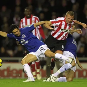 Jagielka and Arteta's Overpowering Sandwich: Everton's Victory Over Sunderland's Cattermole (BPL 2010) Jagielka and Arteta's Overpowering Sandwich: Everton's Victory Over Sunderland's Cattermole (BPL 2010)