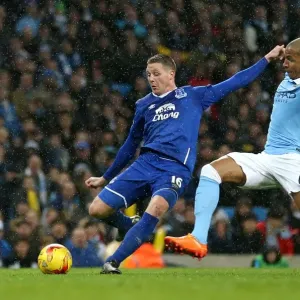 James McCarthy Faces Pressure from Fernando: Everton's Tense Shot in Capital One Cup Semi-Final at Etihad Stadium James McCarthy Faces Pressure from Fernando: Everton's Tense Shot in Capital One Cup Semi-Final at Etihad Stadium