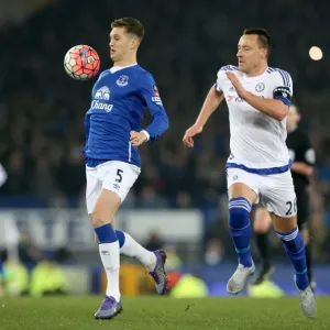 John Terry vs. John Stones: A Battle for the Ball in the Emirates FA Cup Quarterfinal at Goodison Park John Terry vs. John Stones: A Battle for the Ball in the Emirates FA Cup Quarterfinal at Goodison Park