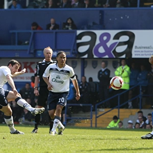Leighton Baines Scores the Opener: Everton's Triumph at Portsmouth in the Barclays Premier League (2009)