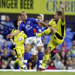 Leon Osman vs Matthew Lowton: Everton vs Sheffield United - Carling Cup Second Round Battle at Goodison Park Leon Osman vs Matthew Lowton: Everton vs Sheffield United - Carling Cup Second Round Battle at Goodison Park
