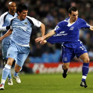 Manchester City v Everton Evertons Leon Osman and Manchester Citys Stephen Jordan