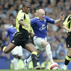 Manchester Citys Sylvain Distin battles with Evertons Andrew Johnson Manchester Citys Sylvain Distin battles with Evertons Andrew Johnson