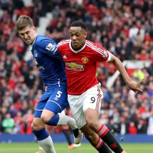 Manchester United vs Everton Print: Anthony Martial and John Stones in Mid-Air