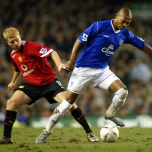 Marcus Bent gets away from Paul Scholes