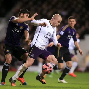 Naismith vs. Tomkins: A FA Cup Showdown - Everton's Steven Naismith and West Ham United's James Tomkins in an Intense Battle for the Ball Naismith vs. Tomkins: A FA Cup Showdown - Everton's Steven Naismith and West Ham United's James Tomkins in an Intense Battle for the Ball