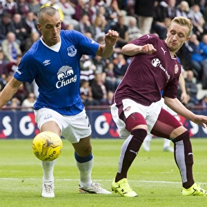 Osman vs. McKirdy: A Battle for the Ball in Everton's Pre-Season Clash at Tynecastle Stadium
