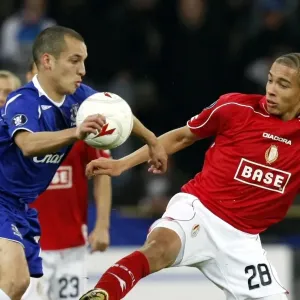 Osman vs. Witsel: Battle in the UEFA Cup - Everton's Leon Osman Clashes with Standard Liege's Axel Witsel Osman vs. Witsel: Battle in the UEFA Cup - Everton's Leon Osman Clashes with Standard Liege's Axel Witsel