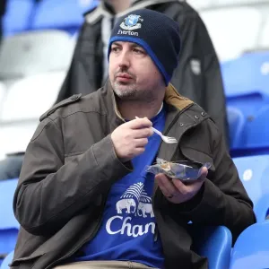Everton Fan Enjoying a Pie at Goodison Park Print