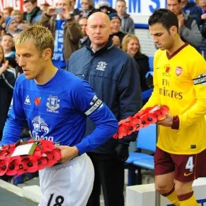 Phil Neville and Cesc Fabregas Lead Out Poppy Wreaths: Everton vs. Arsenal in the Barclays Premier League (November 14, 2010) Phil Neville and Cesc Fabregas Lead Out Poppy Wreaths: Everton vs. Arsenal in the Barclays Premier League (November 14, 2010)