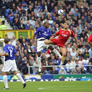 Soaring High: Joseph Yobo's Dominant Height Over Portsmouth in Everton FC