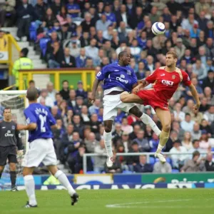 Soaring High: Joseph Yobo's Dominant Height Over Portsmouth in Everton FC Soaring High: Joseph Yobo's Dominant Height Over Portsmouth in Everton FC