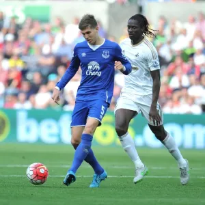 Swansea's Eder Clashes with Everton's John Stones in Intense Barclays Premier League Match Swansea's Eder Clashes with Everton's John Stones in Intense Barclays Premier League Match