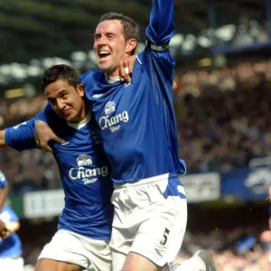 Tim Cahill congratulates David Weir on his opening goal