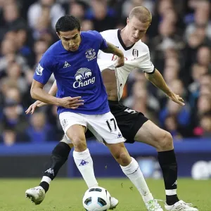 Tim Cahill Shields Ball from Brede Hangeland: Everton vs Fulham, Barclays Premier League (19 March 2011) Tim Cahill Shields Ball from Brede Hangeland: Everton vs Fulham, Barclays Premier League (19 March 2011)