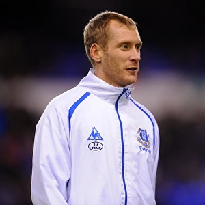 Tony Hibbert's Unyielding Spirit: Everton's Defender in Determined Fifth Round FA Cup Battle vs. Reading at Goodison Park (01 March 2011)
