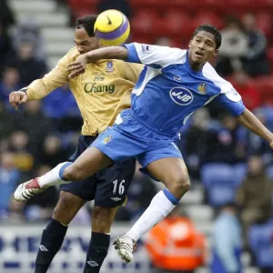 Wigan Athletics Valencia challenges Evertons Lescott for the ball during their English Premier Lea Wigan Athletics Valencia challenges Evertons Lescott for the ball during their English Premier Lea