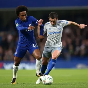 Willian vs. Baines: Battle for the Ball in Carabao Cup Fourth Round Clash between Chelsea and Everton at Stamford Bridge Willian vs. Baines: Battle for the Ball in Carabao Cup Fourth Round Clash between Chelsea and Everton at Stamford Bridge