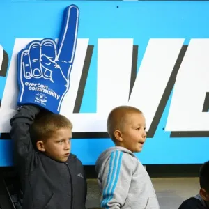 Young Everton Fan Waves Giant Foam Hand at Throbbing Goodison Park During Everton vs Stoke City, Barclays Premier League (2010)
