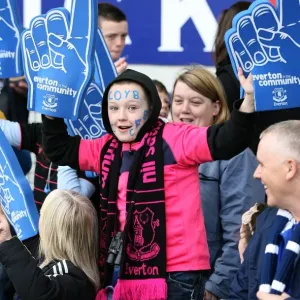 Young Everton Fan's Thrill: Half-Time Excitement at Goodison Park with Giant Foam Hands (Everton vs Stoke City, Barclays Premier League, 2010)