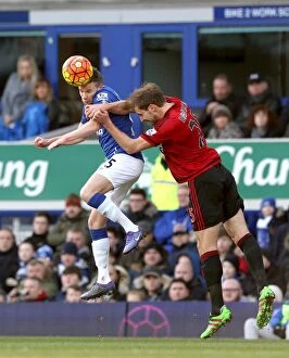 Images Dated 13th February 2016: Aerial Clash: Cleverley vs. Dawson at Goodison Park - Everton vs. West Bromwich Albion