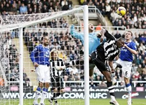 Images Dated 22nd February 2009: Ameobi vs. Howard: Battle at St. James Park - Everton's Tim Howard Clashes with Newcastle's Shola