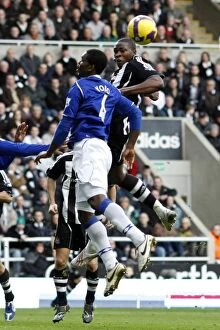 Images Dated 22nd February 2009: Ameobi vs. Yobo: Battle of the Premier League Titans at St. James Park (Newcastle United vs)