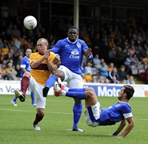 Season 2012-13 Prints: Anichebe and Vellios vs. Law: Everton's Star Forwards Face Off in Pre-Season Clash at Fir Park Stadium