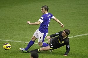 Images Dated 26th December 2012: Baines vs. Stam: Everton's Intense Battle Against Wigan Athletic at Goodison Park