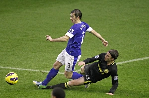 Baines vs. Stam: Everton's Intense Battle Against Wigan Athletic at Goodison Park