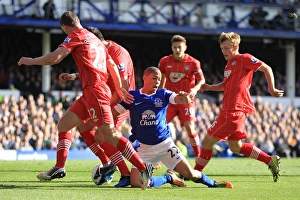 Everton's Steven Pienaar (centre) goes to ground following a combination of challenges from the Southampton defence Barclays Premier League - Everton v Southampton - Goodison Park