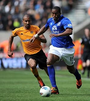 06 May 2012 v Wolverhampton Wanderers, Molineux Stadium Collection: Battle for the Ball: Distin vs. Henry - Everton vs. Wolverhampton Wanderers