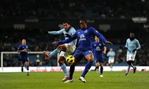 Framed Print : Battle for the Ball: Distin vs Tevez - A Premier League Rivalry (Manchester City vs Everton, 20 December 2010)