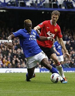 Images Dated 29th October 2011: Battle for the Ball: Evans vs. Saha - Everton vs. Manchester United, Premier League Rivalry (2011)